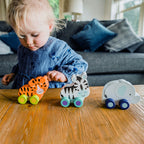 Juguetes de empuje selva de madera en escena, cebra con ruedas incluida